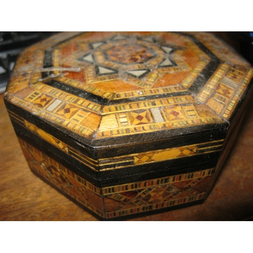 126 - A small, beautifully inlaid jewellery box with some damage to top containing an assortment of qualit... 