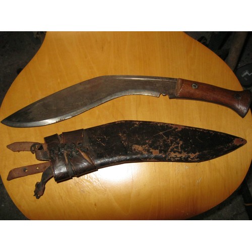 142 - A military Gurkha Kukri attached to a 58 pattern webbing belt with various pouches attached