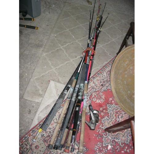 211 - A large selection of fishing rods and other equipment including lures, reels, hooks, weights etc