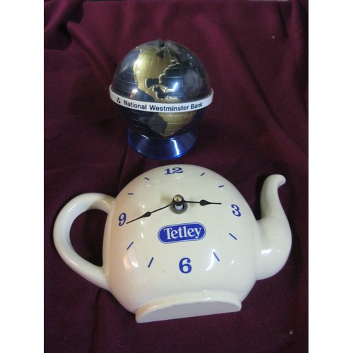 36 - Plastic Tetley's tea Battery operated clock along with a National Westminster bank globe savings coi... 