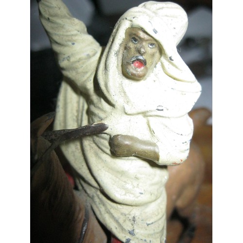 205 - A vintage Germany made lead soldier figure of an Bedouin tribesman on a horse brandishing a rifle, s... 