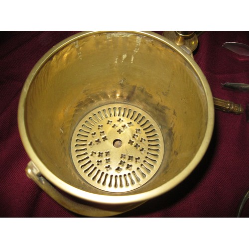 204 - A selection of brassware and other metal items including a small brass bucket, brass and other corks... 