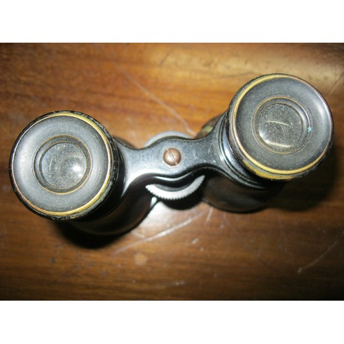 246 - A pair of cased field or opera glasses optically and cosmetically very good, the case named to Mouro... 