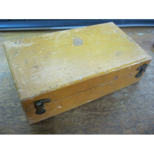 259 - A wooden cased weight set, one weight missing