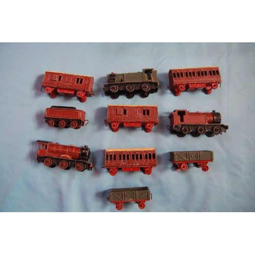 252 - A small collection of early Meccano Dinky Toys railway engines, wagons and carriages, some with orig... 