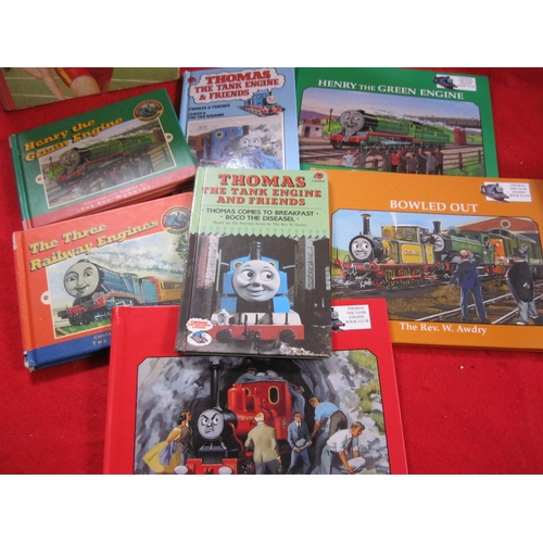 329 - A selection of Thomas the Tank Engine books and 4 vintage children's annuals including Roy Rogers