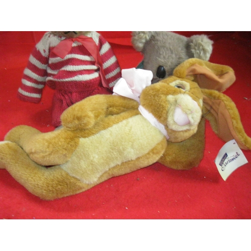 330 - An antique teddy bear, a koala teddy bear and a Cadbury's Caramel soft toy bunny with tags