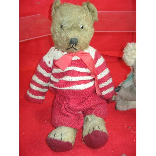 330 - An antique teddy bear, a koala teddy bear and a Cadbury's Caramel soft toy bunny with tags