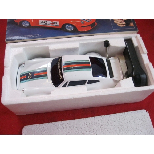 332 - A vintage electronic sonic controlled Porsche car, boxed, excellent condition with minor signs of we... 