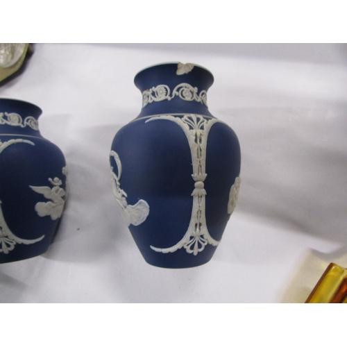 128 - 2 Wedgwood style John Adams blue background 5 inch vases .
One is in mint condition the other has a ... 