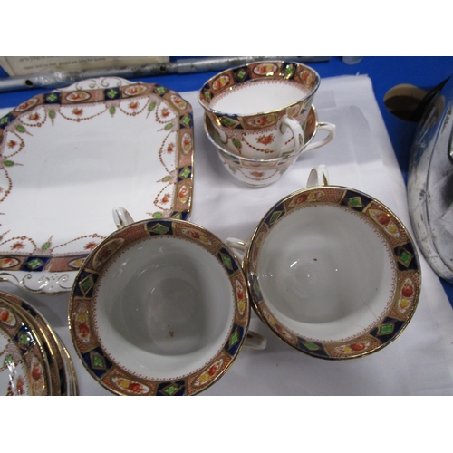 139 - A Teaset consisting of a cake plate 6side plates and six cups and saucers along with 5 Ironstone chi... 