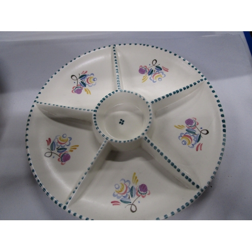 142 - Two Poole Pottery Footed Eggcups with sprig patterns along with a 9 inch 6 sectioned dish and a 10 i... 