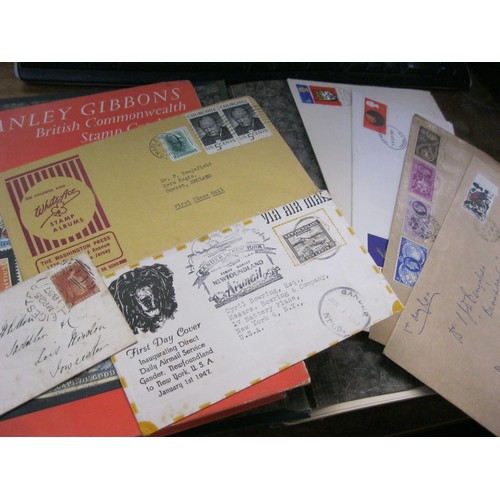 352 - A vintage stamp album plus a selection of first day covers, a Penny Red stamped 1857 envelope and ot... 