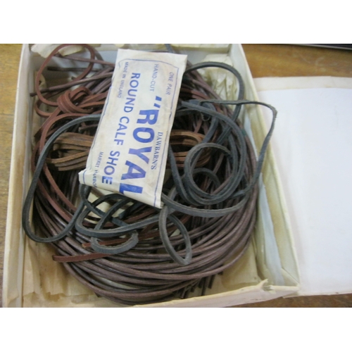 362 - An antique box containing leather shoe laces by The 