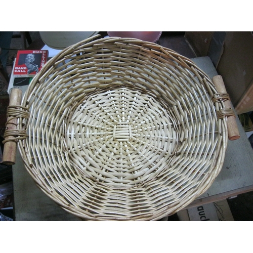 392 - 4 woven baskets in good order including one with wooden grips