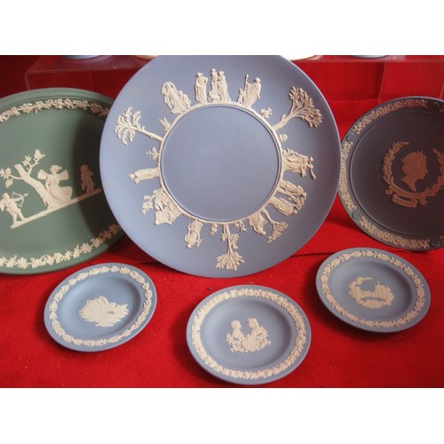 26 - A selection of Wedgwood to include a boxed Christmas egg ,Christening spoon ,bells , 4 inch Plaques ... 