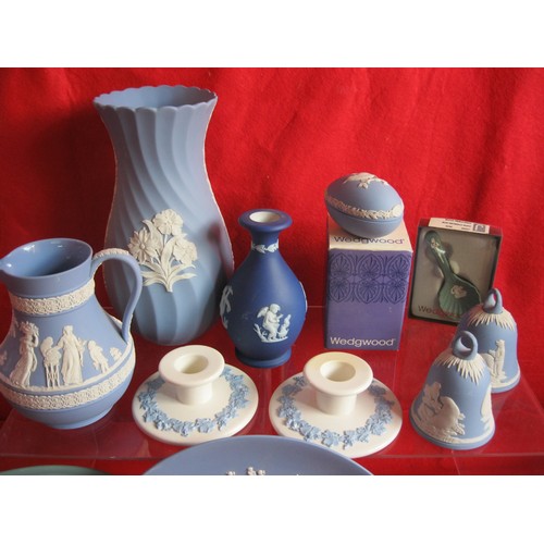 26 - A selection of Wedgwood to include a boxed Christmas egg ,Christening spoon ,bells , 4 inch Plaques ... 