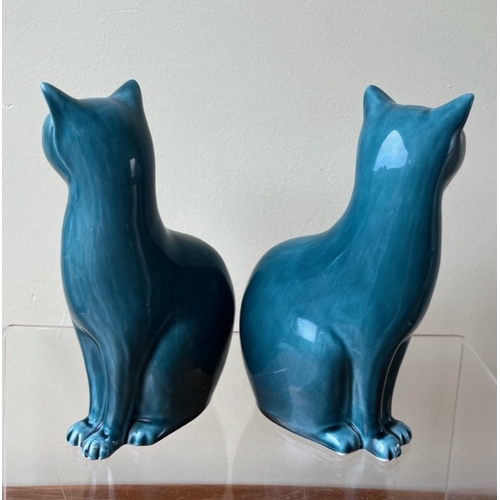 179 - Pair of small mid century Teal Blue Poole Pottery Cats.

Approximately 16.5cm tall.