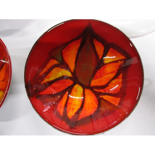 216 - Four lovely items of Poole Pottery Delphis Three with red background one with orange background .
A ... 