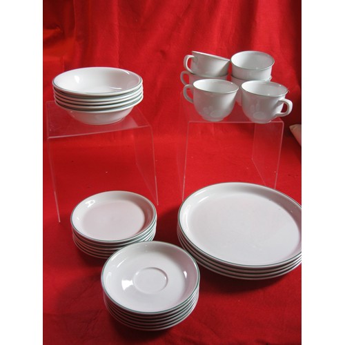 224 - A Poole Pottery dinner service, white with green trim, 'Tango' pattern, microwave & dishwasher safe