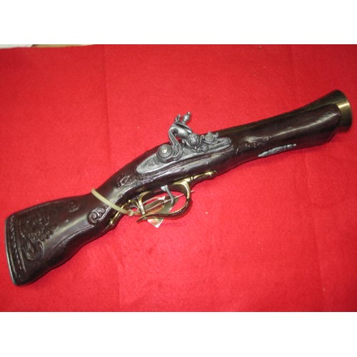 194 - A Spanish-made replica blunderbuss with flintlock and bell-mouth, with tags but unboxed