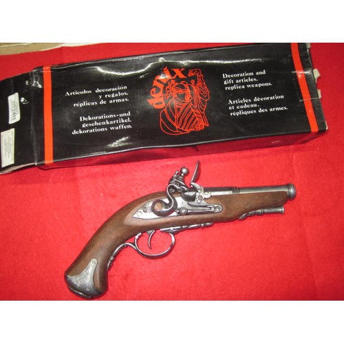 195 - A Spanish-made Denix replica flintlock pistol, catalogue number 1056G, boxed but minor damp damage t... 