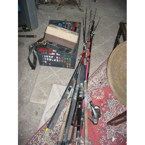 275 - A large selection of fishing rods and other equipment including lures, reels, hooks, weights etc