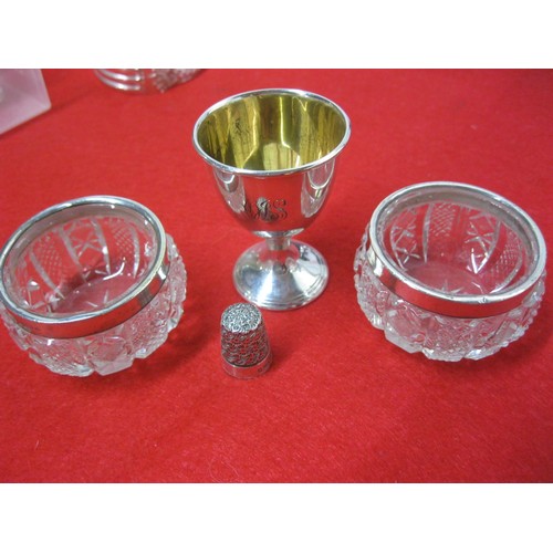 261 - A silver egg cup hallmarked Chester 1919 together with a pair of silver salts hallmarked Birmingham ... 