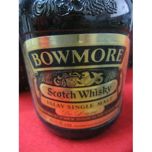 289 - A vintage bottle of Bowmore Islay single malt Scotch whiskey in presentation box with two Bowmore br... 