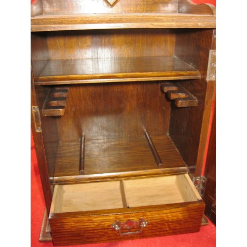 280 - Pipe smoker's cabinet with space for six pipes along with a slide out draw.