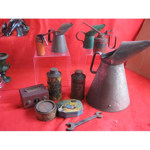 11 - A selection of motoring memorabilia including oil cans, oil measures and some advertising