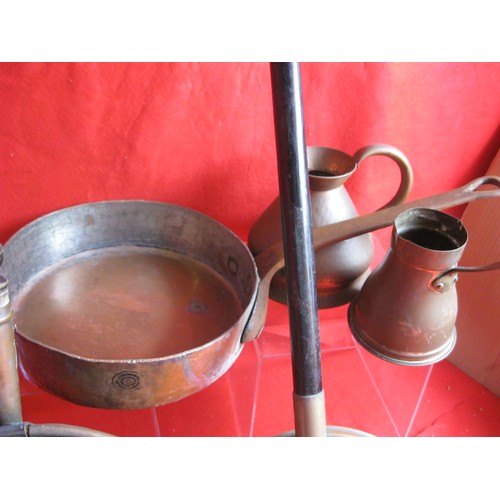 22 - An assortment of copper items including a vintage Leon Jaggi & Sons copper frying pan, bed pans etc