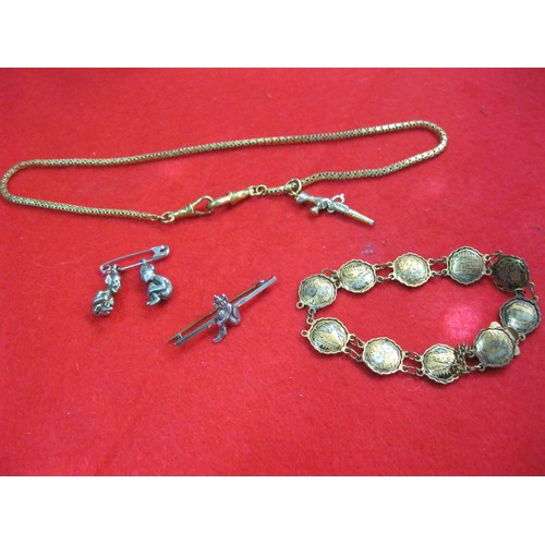 238 - A gold plated watch chain with a watch key in the shape of a flintlock pistol, a bracelet and severa... 