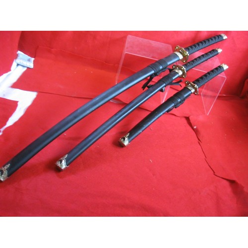 200 - A set of three modern Samurai swords