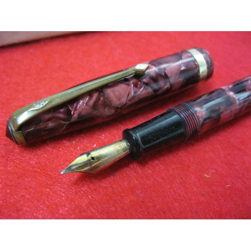 141 - A Conway Stewart 851 Lever Fill Fountain Pen, boxed, 14ct gold nib, red finish. Used, but in lovely ... 