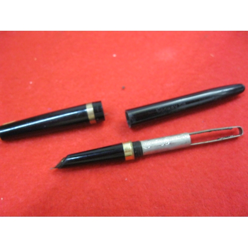 151 - A Conway Stewart Conway 106 in black with gold fittings, pressac fill but rubber bulb missing, 14ct ... 