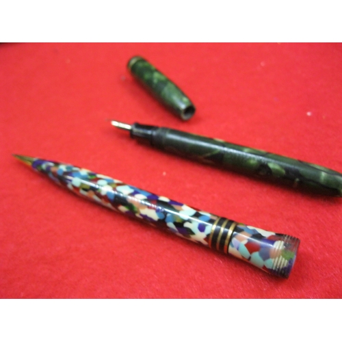 152 - A Conway Stewart Dinkie lever fill fountain pen in green, missing shirt clip fitting but otherwise c... 