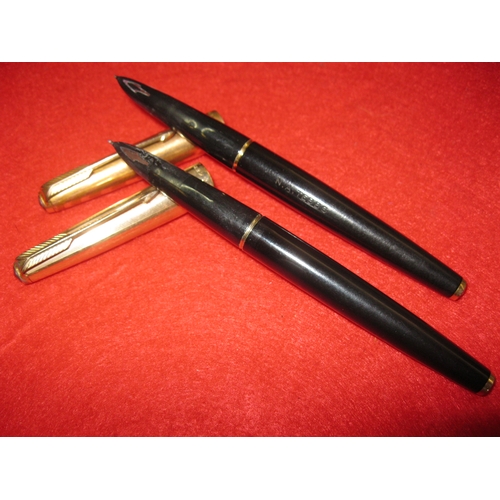 154 - A pair of Parker 61 fountain pens with gold plated caps, one 12ct the other 14ct, one inscribed 'N A... 