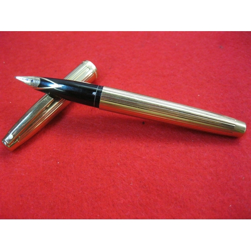 158 - A Sheaffer Imperial gold plated fountain pen with 14ct gold nib, inscribed TCB to side, in apparent ... 