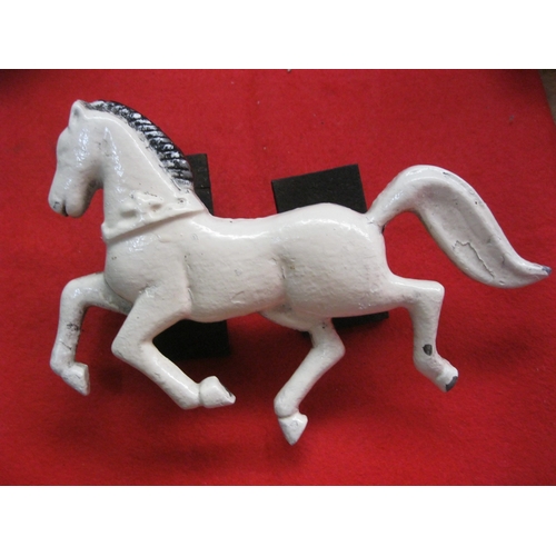 30 - A vintage cast iron horse, white painted, with mounting brackets to rear