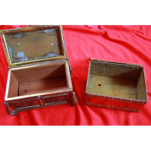 34 - A pair of decorative and heavy brass trinket boxes, one set with a stone to the top, the other with ... 