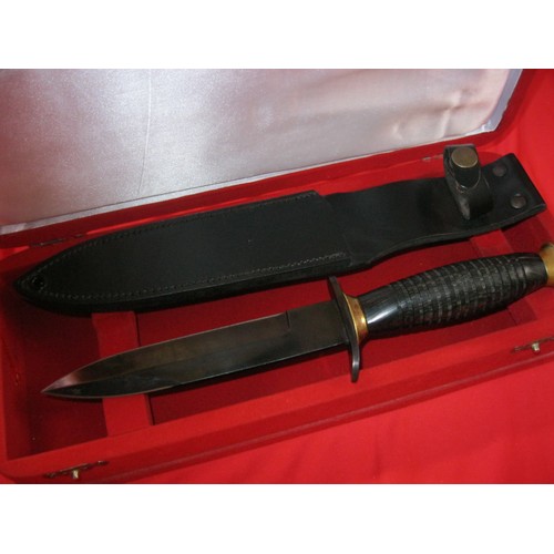 204 - A presentation M3 Trench Knife inscribed for the Pakistan Army's Special Service Group, in red velve... 