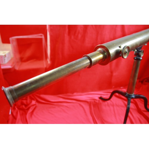 183 - An antique brass spotting scope on stand with assorted eyepieces and other accessories