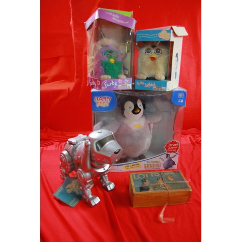 328 - A Happy Feet Mumble dancing figure in original packaging, a pair of Furby's in original packaging an... 