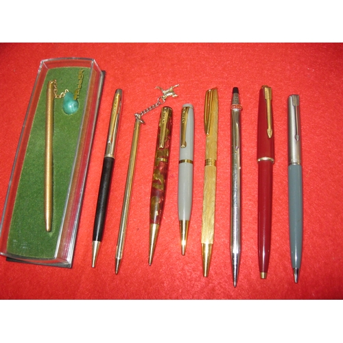 129 - A pair of vintage Burnham pencils and a selection of ballpoint pens including a gold plated Waterman... 