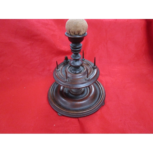 294 - A Victorian bobbin holder with an additional pin cushion.
A lovely item approx 12 inches tall by8 wi... 