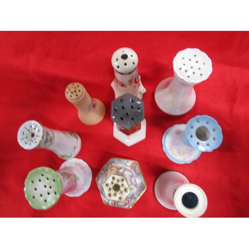 127 - A Selection of Continental  ceramic or porcelain hatpin stands 9 in total of which the largest is 6 ... 