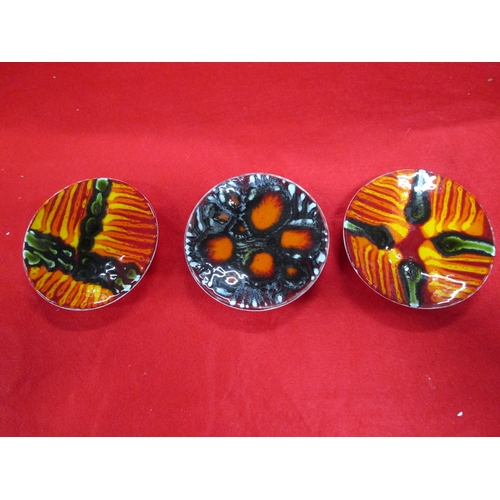 131 - Three Very interesting Poole Pottery shape 49 pin dishes 
left to right
Tina Fancy  painted the 1st ... 