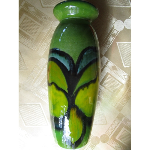 97 - A Poole pottery shape 15 hand thrown Delphis green background vase in pristine condition.
Approx 8 i... 