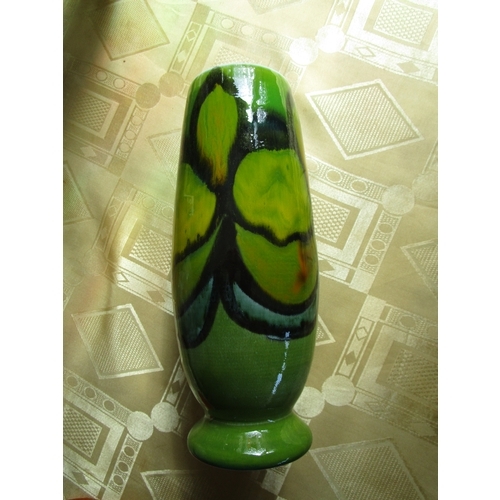 97 - A Poole pottery shape 15 hand thrown Delphis green background vase in pristine condition.
Approx 8 i... 